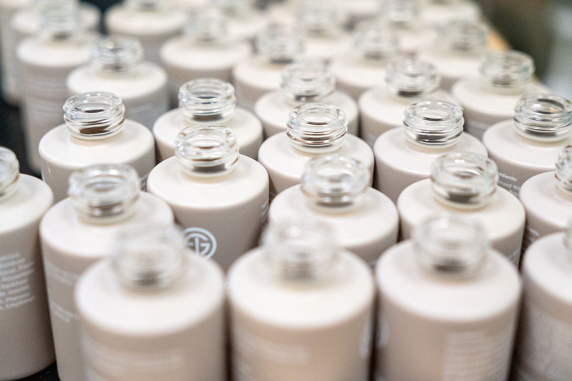 Rows of bottles with printed custom labels